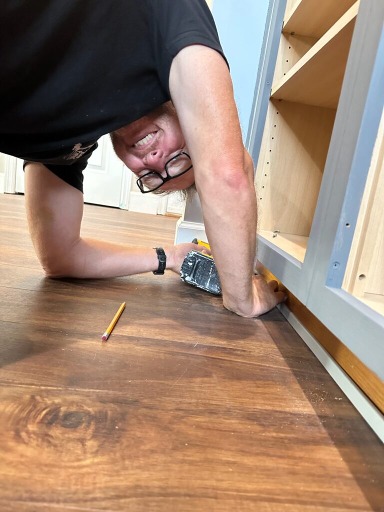 Rich from Just Add Paint Performing Acrobatics While Installing Base Molding, Just For The Challenge