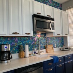 Two-tone kitchen with bright white upper cabinets and Sherwin-Williams Naval blue lowers, refinished by Just Add Paint in Harrisburg, PA.